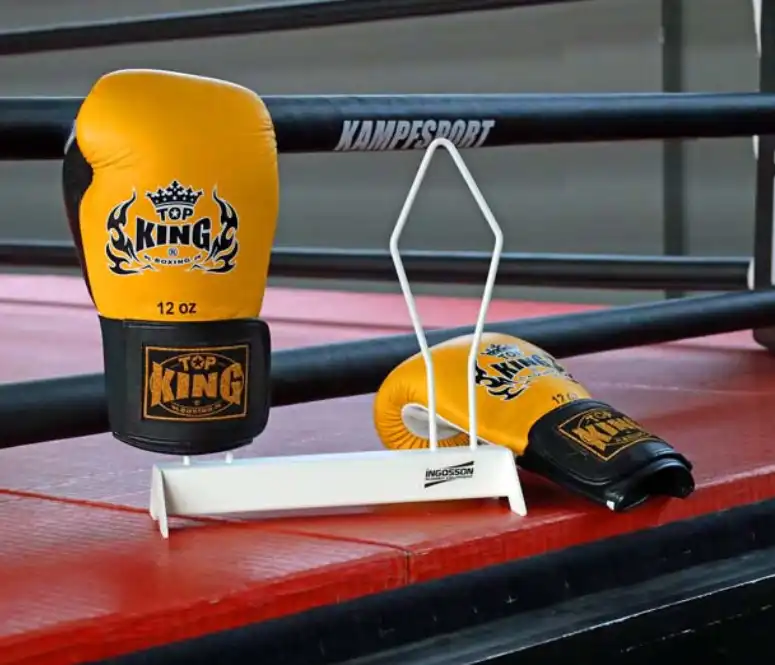 white boxing glove rack placed in a boxing ring